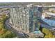 Aerial shot showcasing the condo, cityscape, pool, and surrounding greenery at 788 W Marietta Nw St # 403, Atlanta, GA 30318