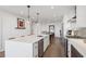 Bright modern kitchen with stainless steel appliances, large island, and stylish pendant lighting at 788 W Marietta Nw St # 403, Atlanta, GA 30318