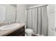 Bathroom featuring a sink, toilet, and a shower with gray shower curtain at 167 Diamond Ridge Ave, Canton, GA 30114