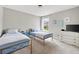 Bright bedroom featuring two beds and a white dresser at 167 Diamond Ridge Ave, Canton, GA 30114