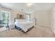 Comfortable bedroom with a large window, plush carpeting, and neutral decor at 167 Diamond Ridge Ave, Canton, GA 30114