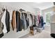 Walk-in closet features ample hanging space and a window for natural light at 167 Diamond Ridge Ave, Canton, GA 30114