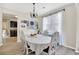 Bright dining area with hardwood floors, white table and chairs, and abundant natural light at 167 Diamond Ridge Ave, Canton, GA 30114