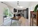 Bright kitchen featuring dark cabinets, stainless steel appliances, and sliding glass doors to the outdoor patio at 167 Diamond Ridge Ave, Canton, GA 30114