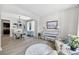 Bright living room with hardwood floors, a charming dining area, and comfortable furnishings at 167 Diamond Ridge Ave, Canton, GA 30114