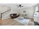 Bright living room with hardwood floors, comfortable seating, and a staircase to the upper level at 167 Diamond Ridge Ave, Canton, GA 30114
