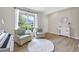 A serene living room featuring hardwood floors, natural light, and stylish decor at 167 Diamond Ridge Ave, Canton, GA 30114