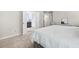 Spacious primary bedroom with ensuite bath featuring neutral decor and soft carpeting at 167 Diamond Ridge Ave, Canton, GA 30114