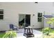 Back patio with a fire pit and seating area at 167 Diamond Ridge Ave, Canton, GA 30114