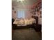 Bedroom featuring a bed and light pink walls at 1793 Cutters Mill Way, Lithonia, GA 30058