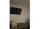 Living area features a mounted TV with an ottoman and sofa set at 1793 Cutters Mill Way, Lithonia, GA 30058