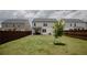Spacious backyard with a privacy fence and a view of the home's exterior at 2159 Redfern Rd, Dacula, GA 30019