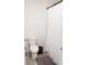 This bathroom features a shower and tub combination and a neutral sink and toilet at 2159 Redfern Rd, Dacula, GA 30019