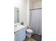 This bathroom features a shower and tub combination as well as a marble sink and toilet at 2159 Redfern Rd, Dacula, GA 30019