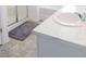 This bathroom features a large marble countertop and a walk-in shower and tub combination at 2159 Redfern Rd, Dacula, GA 30019