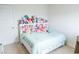This bedroom features neutral carpet and a large bed with lots of stuffed animals at 2159 Redfern Rd, Dacula, GA 30019
