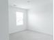 This bedroom features neutral carpet and a window with natural light at 2159 Redfern Rd, Dacula, GA 30019