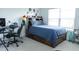This bedroom features neutral carpet and a large bed with built-in storage at 2159 Redfern Rd, Dacula, GA 30019