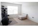 This bedroom features neutral carpet, a large cat tree, and a beige chair at 2159 Redfern Rd, Dacula, GA 30019