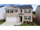 Beautiful two-story home with brick facade, two car garage, and inviting front entrance at 2159 Redfern Rd, Dacula, GA 30019