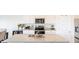 Well-lit kitchen with granite countertops, stainless appliances, and a functional island at 2159 Redfern Rd, Dacula, GA 30019