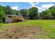 Expansive backyard featuring a new deck and lush green space perfect for outdoor activities and entertaining at 6456 Wright Ne Rd, Atlanta, GA 30328
