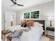 Bright bedroom featuring neutral walls, ceiling fan, hardwood floors, and an abundance of natural light at 6456 Wright Ne Rd, Atlanta, GA 30328
