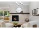 Comfortable living area featuring a painted brick fireplace and neutral decor at 6456 Wright Ne Rd, Atlanta, GA 30328