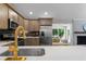 Bright kitchen with stainless appliances, tile backsplash, quartz countertops and gold faucet at 6456 Wright Ne Rd, Atlanta, GA 30328