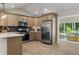 Updated kitchen features stainless steel appliances and opens to a sunroom at 6456 Wright Ne Rd, Atlanta, GA 30328