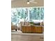 Bright living room with large windows, comfortable seating, and a stylish wooden coffee table at 6456 Wright Ne Rd, Atlanta, GA 30328