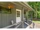 Side view of cozy outdoor shed-porch with comfy seating at 6456 Wright Ne Rd, Atlanta, GA 30328