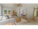 Bright sunroom with a view of the outdoor deck is furnished with neutral-toned furniture at 6456 Wright Ne Rd, Atlanta, GA 30328