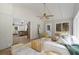 Bright sunroom with ceiling fan opens up to the kitchen and features whitewashed brick at 6456 Wright Ne Rd, Atlanta, GA 30328