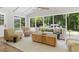 Bright sunroom featuring neutral furnishings, a ceiling fan, and plenty of natural light at 6456 Wright Ne Rd, Atlanta, GA 30328