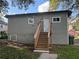 Exterior of house with stairs to the back door and a view of the yard at 2148 Martin Luther King Jr Sw Dr, Atlanta, GA 30310