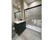 Elegant bathroom with a glass shower, vanity with sink, and modern fixtures at 2148 Martin Luther King Jr Sw Dr, Atlanta, GA 30310