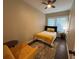 Bright bedroom with a ceiling fan, large window, and comfortable furnishings at 2148 Martin Luther King Jr Sw Dr, Atlanta, GA 30310