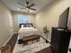 Cozy bedroom with a ceiling fan, ample natural light, and stylish furnishings at 2148 Martin Luther King Jr Sw Dr, Atlanta, GA 30310