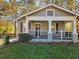 Charming home featuring a inviting front porch and well-maintained lawn at 2148 Martin Luther King Jr Sw Dr, Atlanta, GA 30310