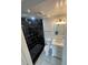 Modern bathroom featuring a sleek black-tiled shower with rainfall showerhead and updated vanity at 4356 Rockbridge Rd, Stone Mountain, GA 30083