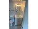 Bright bathroom with a white vanity, lighting and fixtures at 4356 Rockbridge Rd, Stone Mountain, GA 30083