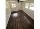 Sunlit bedroom featuring gorgeous hardwood floors and bright, airy feel from large windows at 4356 Rockbridge Rd, Stone Mountain, GA 30083
