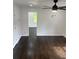 Clean, light bedroom with hard wood floors and ceiling fan at 4356 Rockbridge Rd, Stone Mountain, GA 30083