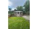 Inviting two-story brick home with a well-manicured lawn and a charming front entrance at 4356 Rockbridge Rd, Stone Mountain, GA 30083
