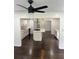 Open-concept kitchen with island, stainless steel appliances, and hardwood floors for a seamless flow at 4356 Rockbridge Rd, Stone Mountain, GA 30083
