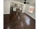 Hardwood floors throughout with large windows providing natural light in the open concept space at 4356 Rockbridge Rd, Stone Mountain, GA 30083