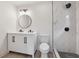Beautiful bathroom with a double vanity, decorative mirror, toilet, and luxurious walk-in shower at 4451 Flat Shoals Pkwy, Decatur, GA 30034