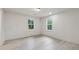 Bright and airy bedroom with new flooring and two windows, providing natural light at 4451 Flat Shoals Pkwy, Decatur, GA 30034