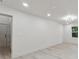 Bright living room with new wood-look flooring, fresh white paint, and ample natural light at 4451 Flat Shoals Pkwy, Decatur, GA 30034